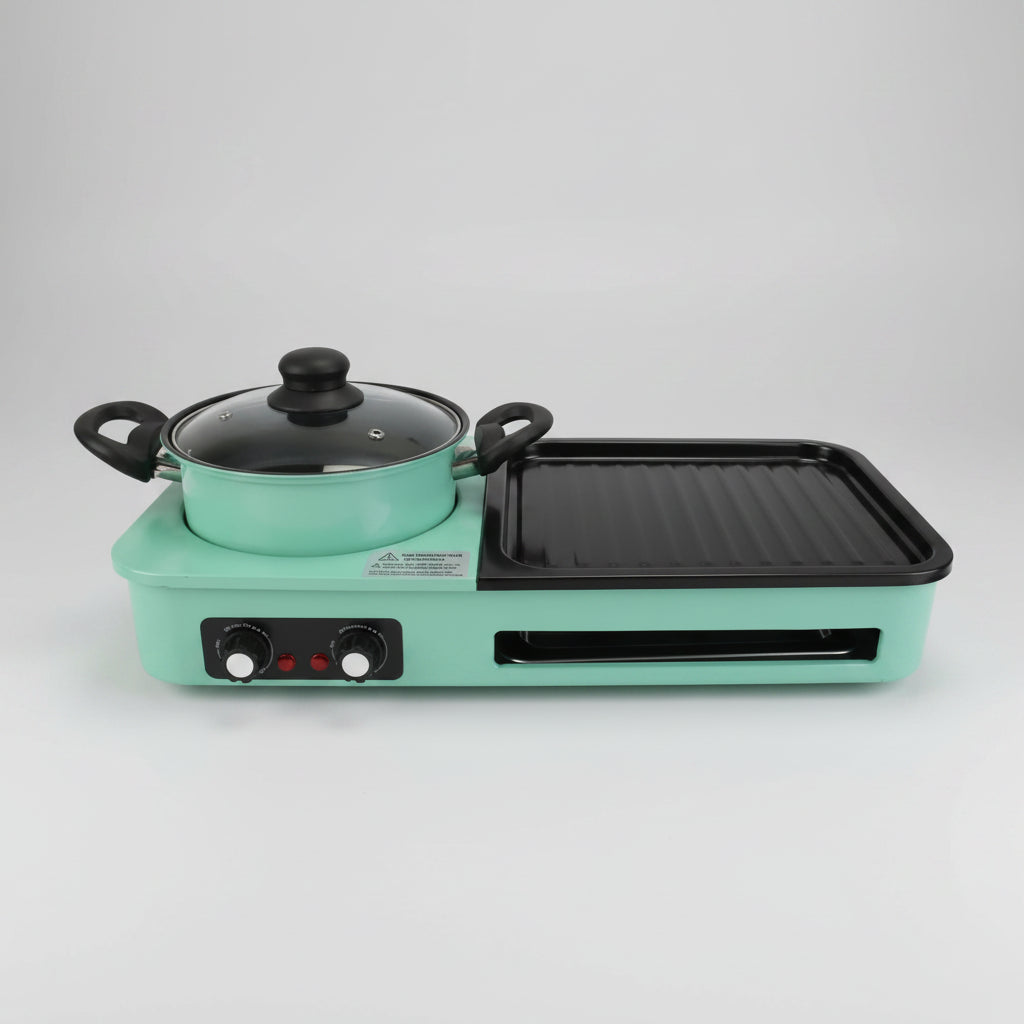A compact electric multi-cooker with a mint green body, featuring a pot with a glass lid on the left burner and a black grill plate on the right burner, set against a plain white background.