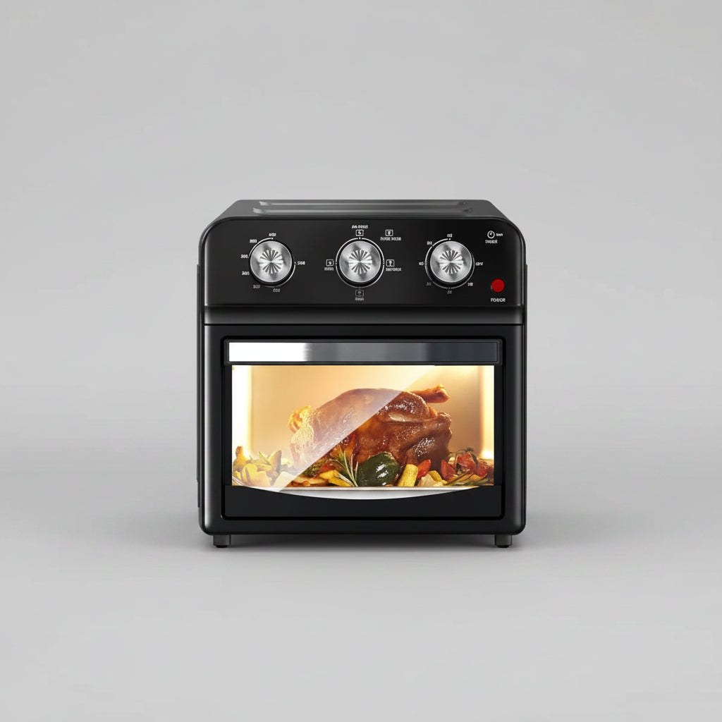 Black oven with food inside on a kitchen counter, surrounded by decor items.