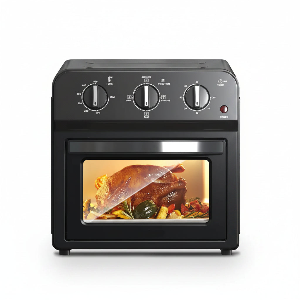 Black air fryer with a roasted chicken inside on a white background