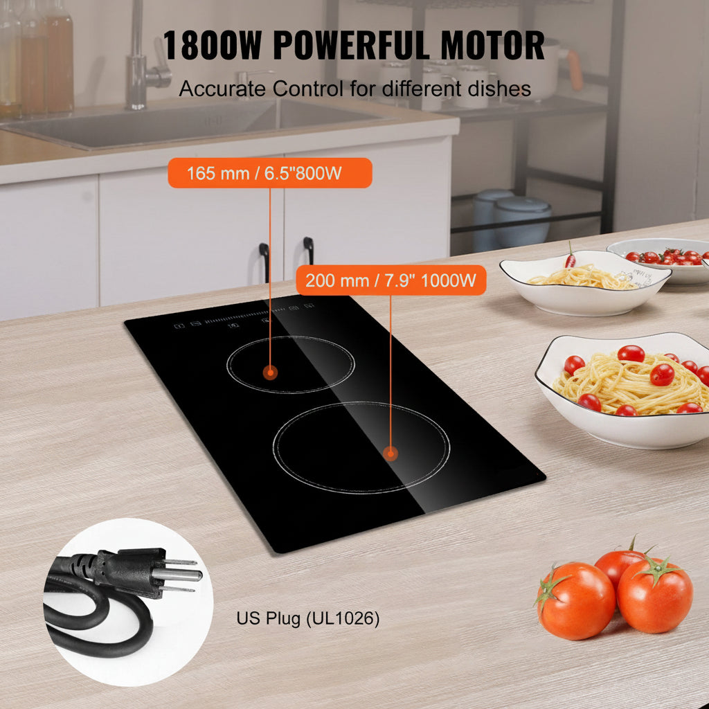 Black glass cooktop with two circular induction burners shown on a light wood kitchen countertop. Orange callout lines label the motor sizes 165 mm / 6.