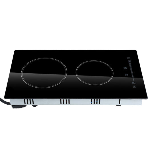 Black induction cooktop with two heating elements on a white background